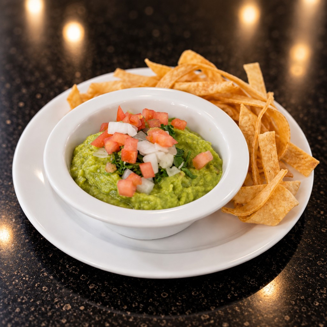 Guacamole with pico de gallo and tortilla chips at Salsa Roja Dallas