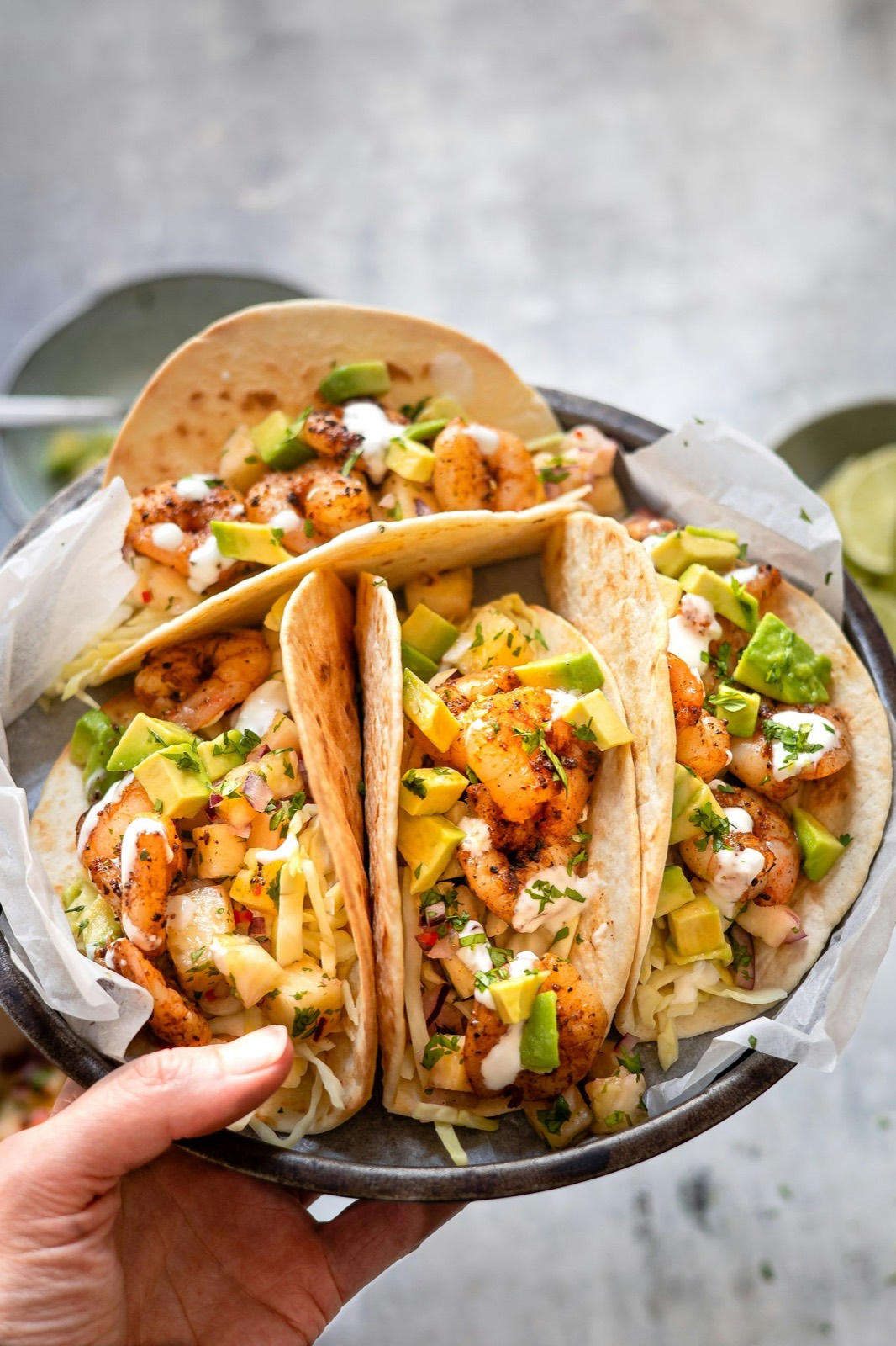 Hot molcajete-style plate with shrimp and salsa
